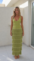 Front view of woman wearing olive green sleeveless tiered fringe maxi dress