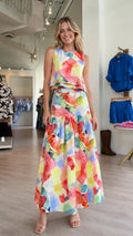 Front view of vibrant watercolor two-piece maxi dress set