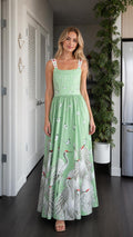 Front view of model wearing sage green crane maxi dress