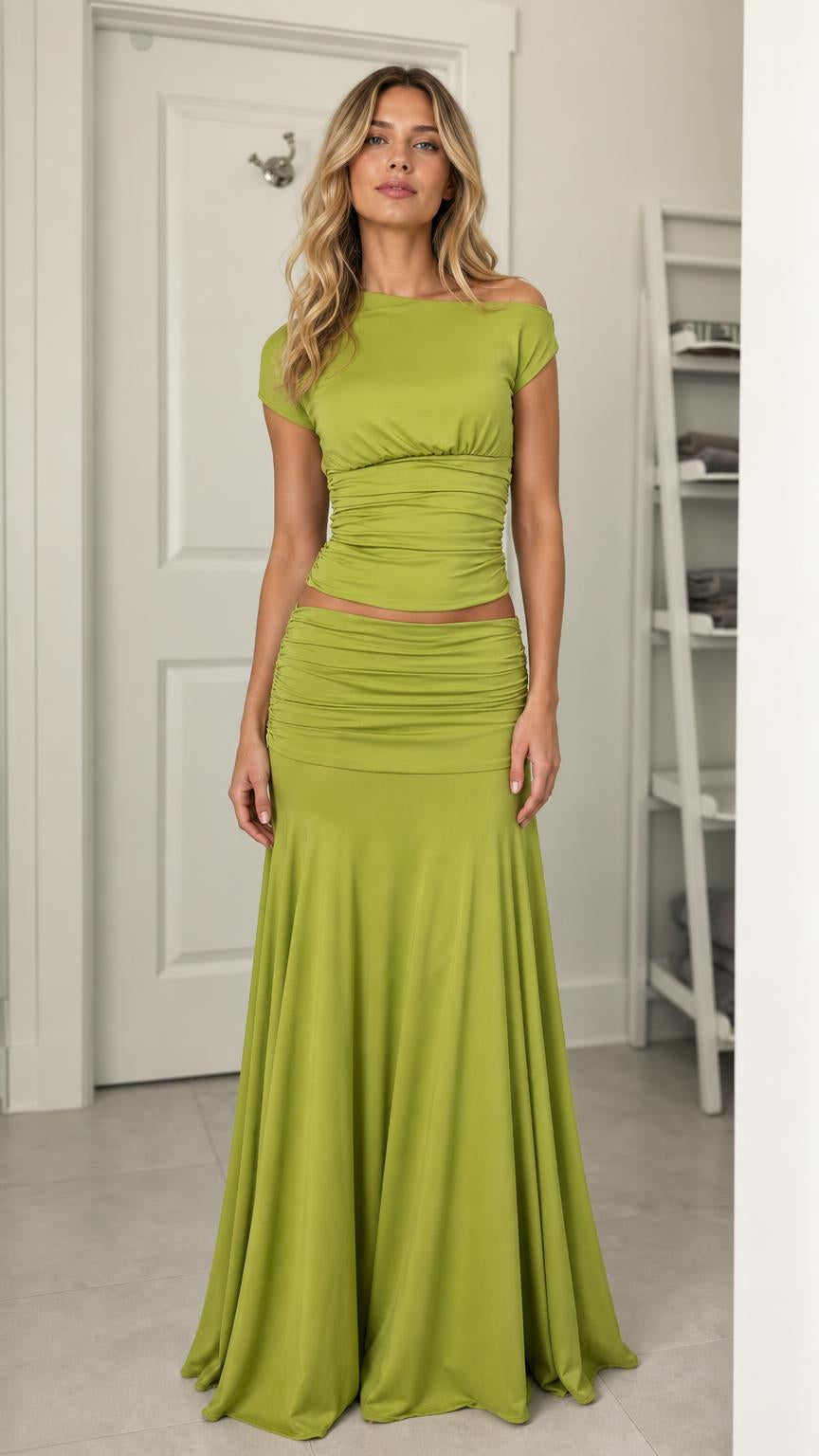 Model wearing olive green ruched top and maxi skirt set from the front