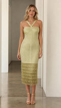 Model wearing olive green halter fringe midi dress, front view