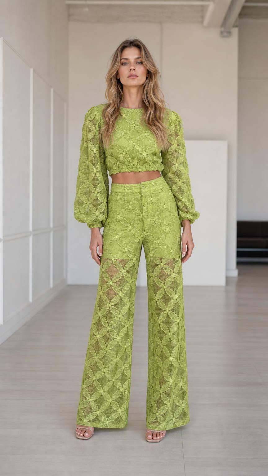 Full front view of model wearing lime green geometric crop top and wide-leg pants set