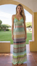 Model wearing Multi Green striped sequin halter maxi dress, front view
