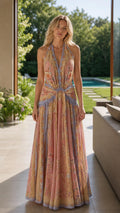 Front view of model wearing pink floral halter maxi dress