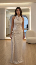 Front view of model wearing white polka dot halter top and maxi skirt set