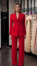 Front view of woman wearing red tailored blazer and matching wide-leg pants