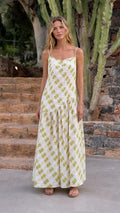 Front view of woman wearing sage green plaid maxi dress outdoors