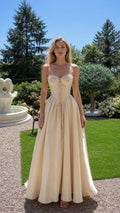 Front view of champagne corset maxi dress outdoors