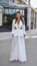 Woman wearing white long sleeve cutout maxi dress, front view