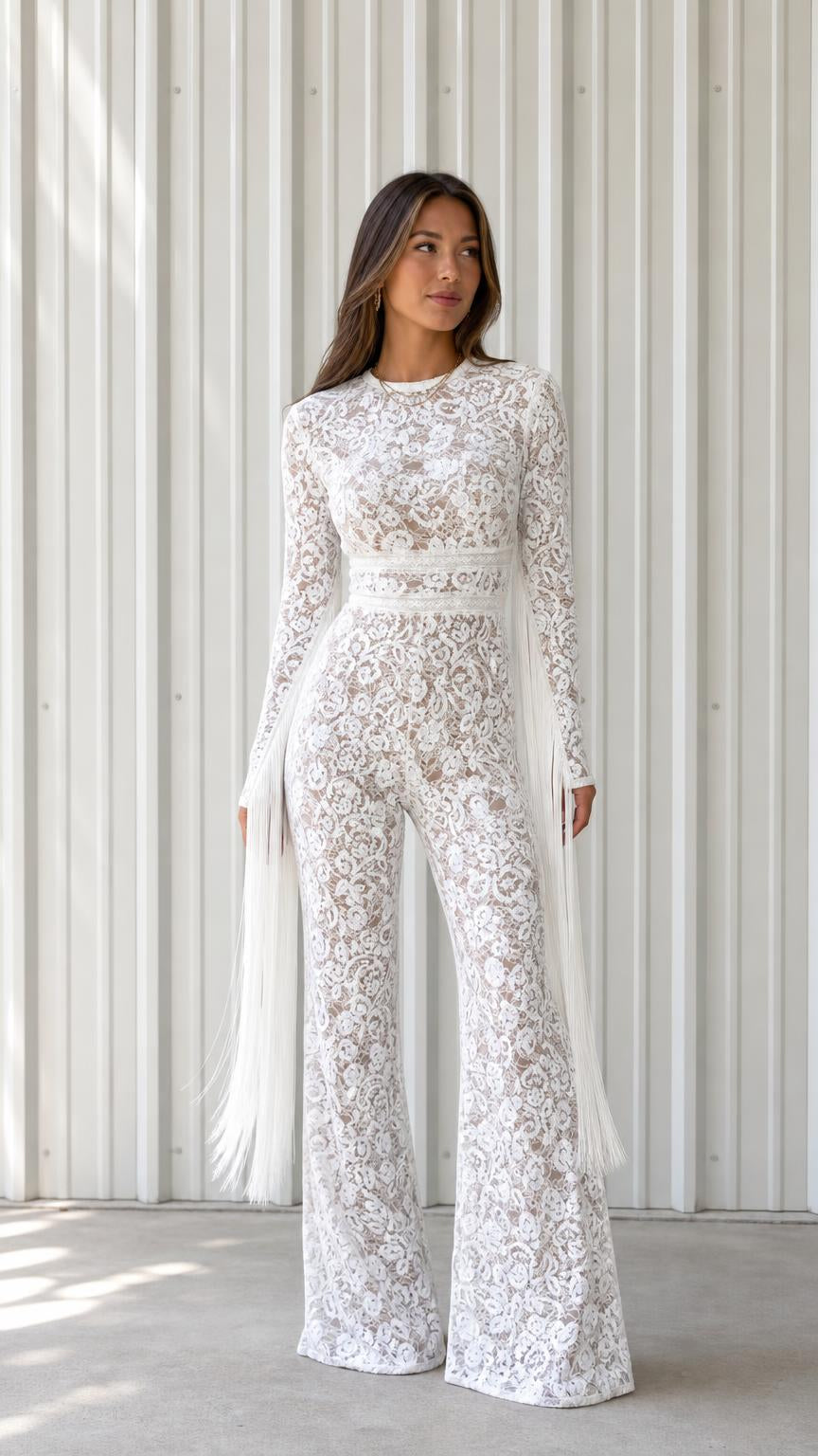 Front view of woman wearing elegant white lace long sleeve wide leg jumpsuit