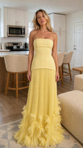 Front view of yellow strapless pleated maxi dress
