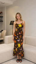 Front view of model wearing brown celestial print maxi dress