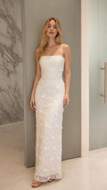Front view of model wearing white floral lace maxi dress