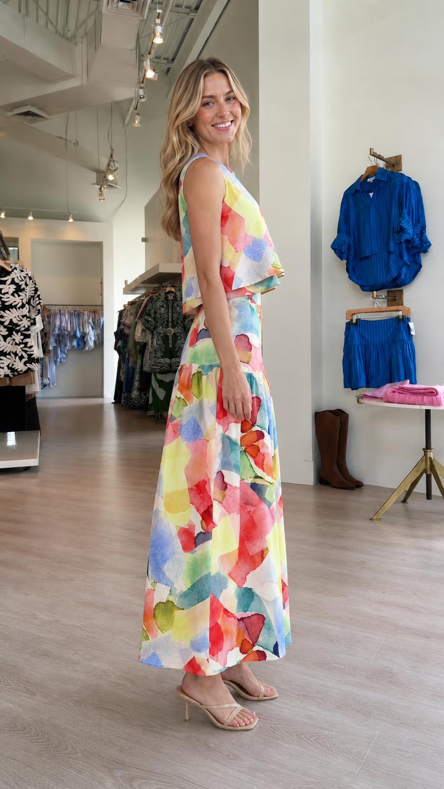Side view of model wearing colorful abstract print set