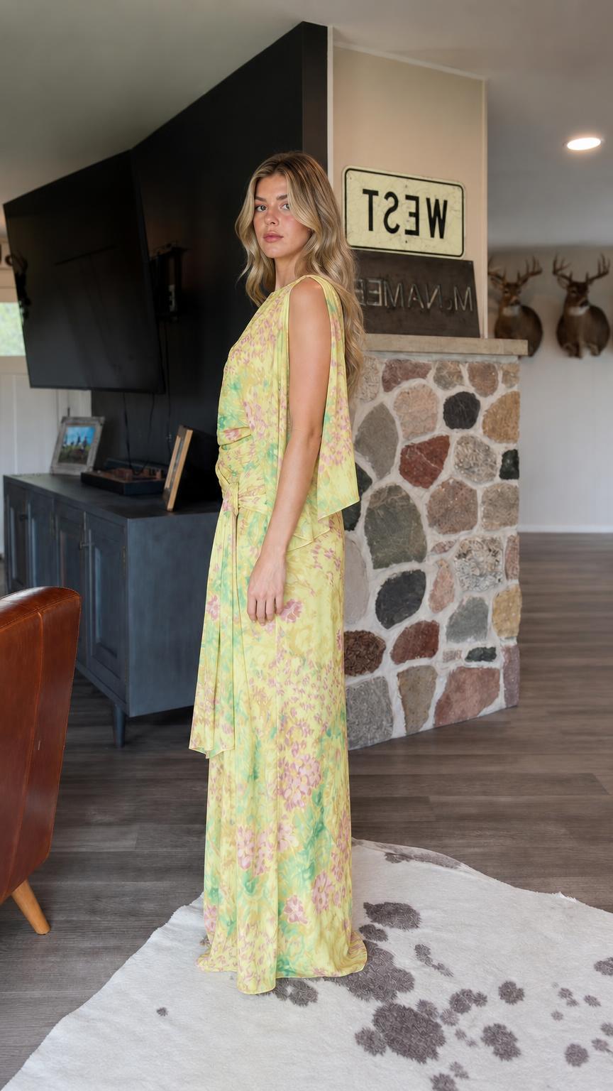 Side profile view of Yellow floral maxi dress