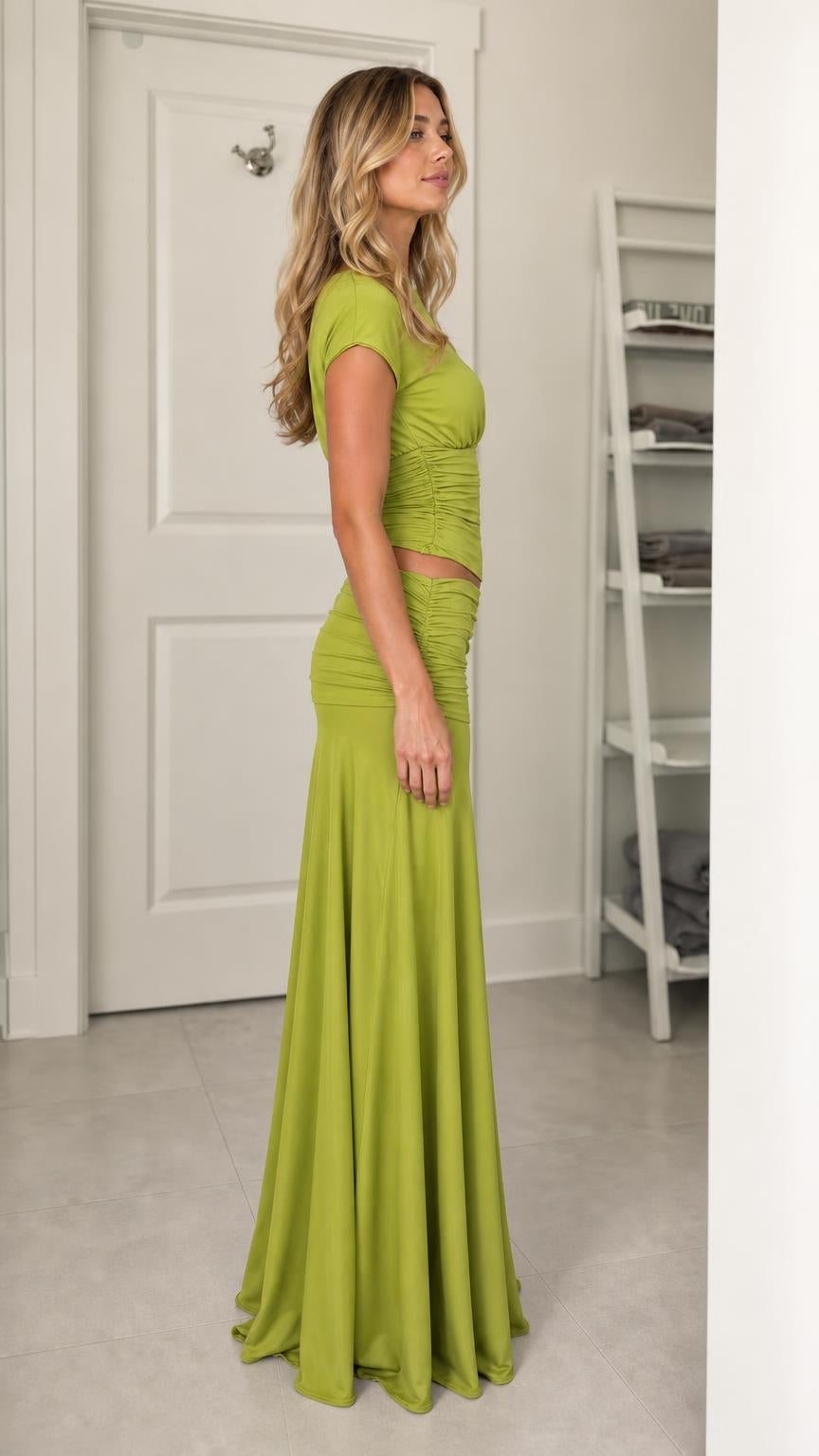 Model wearing olive green two-piece set from the side profile