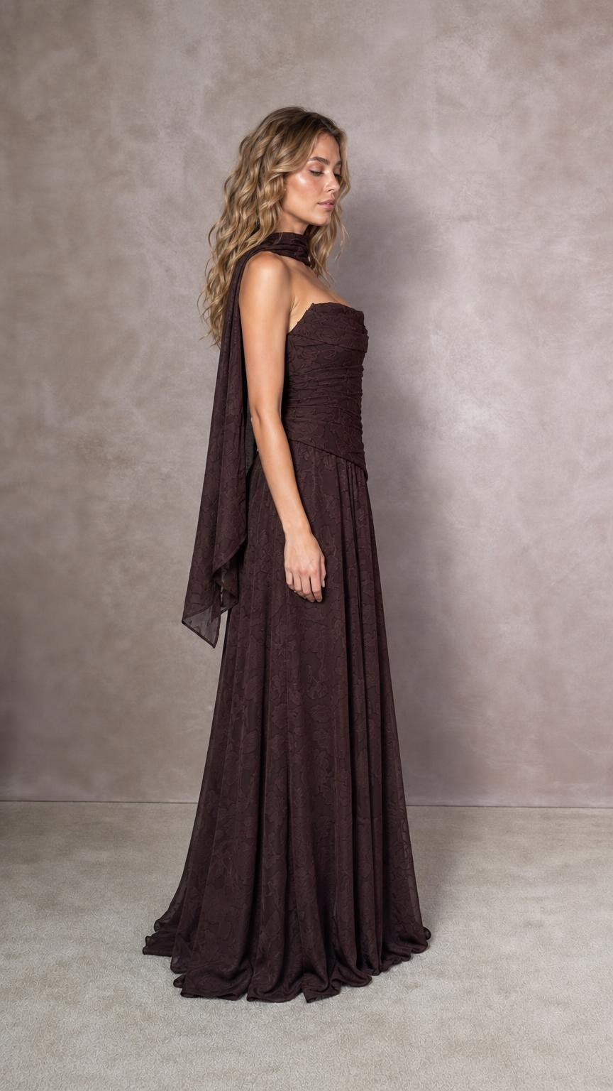 Side profile of model in espresso brown ruched gown