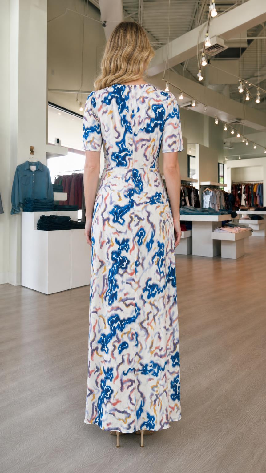 Back view of model wearing white abstract print maxi dress