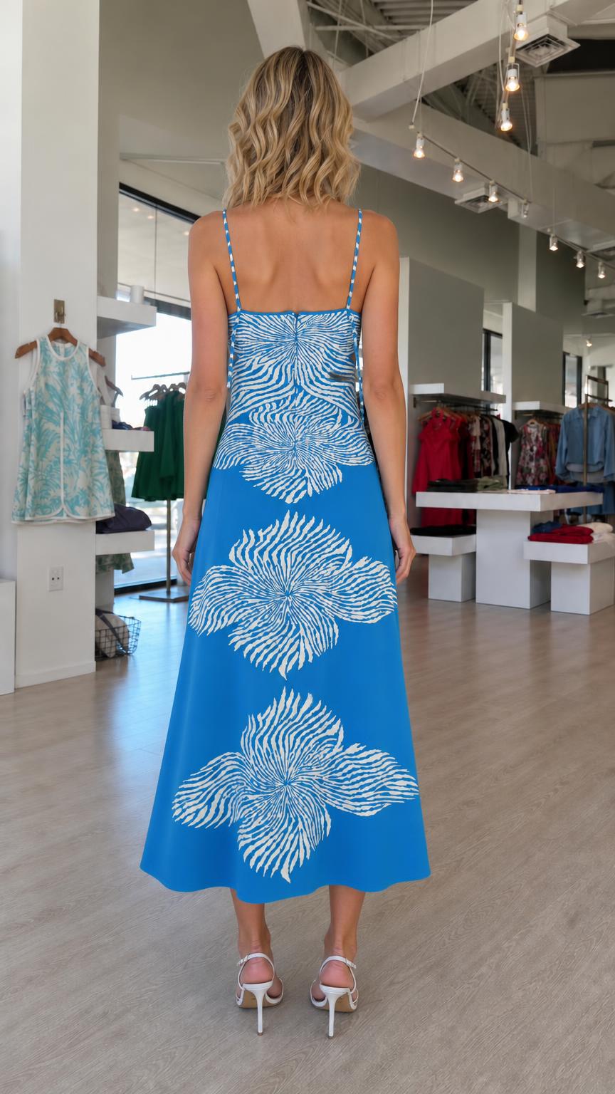 Back view of blue knit midi dress with patterned back panel