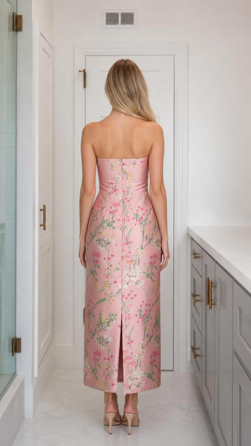 Back view of model wearing pink floral strapless midi dress