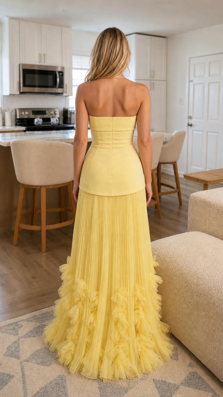 Back view of yellow strapless pleated maxi dress