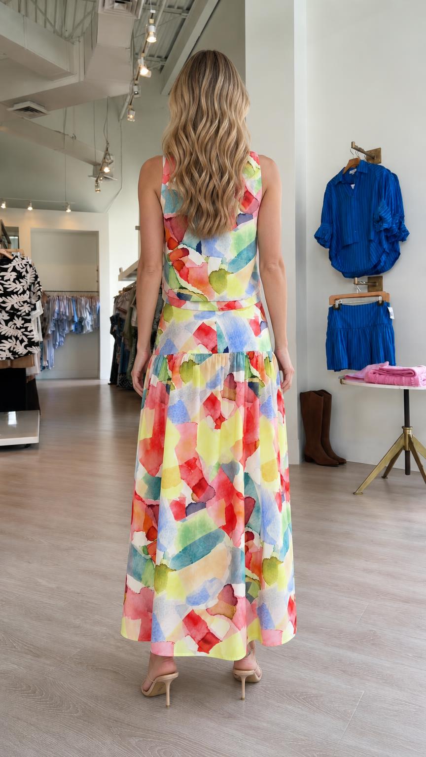 Back view of model in watercolor two-piece maxi outfit