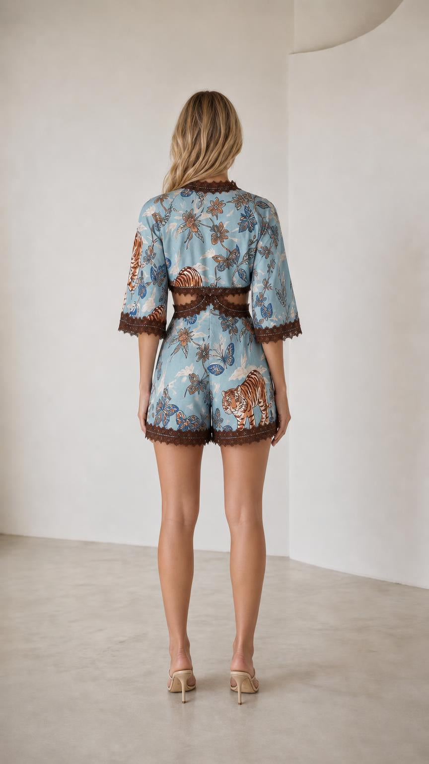Back view of light blue printed crop top and shorts set