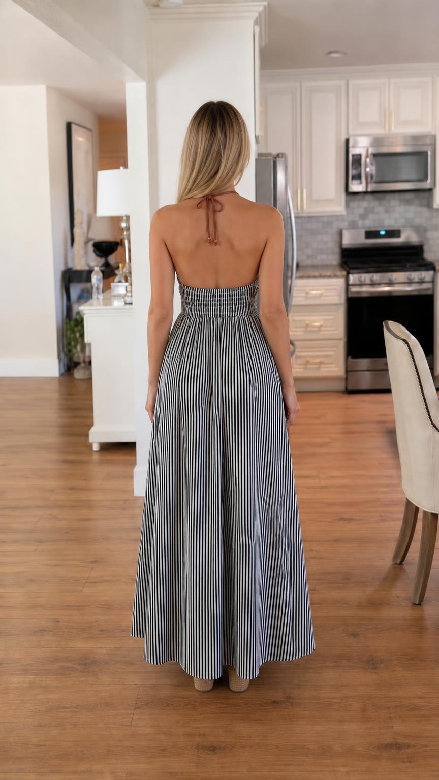 Back view showcasing open back and smocked waist