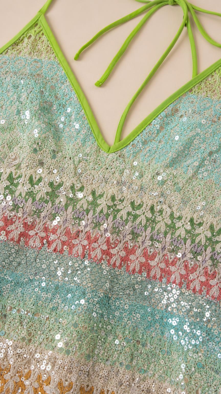 Close-up of the sequin pattern and halter neckline