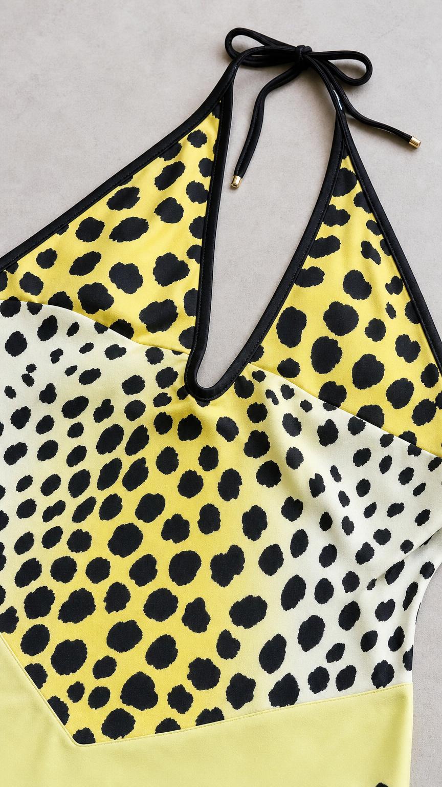 Close up of V-neckline and animal print pattern detail