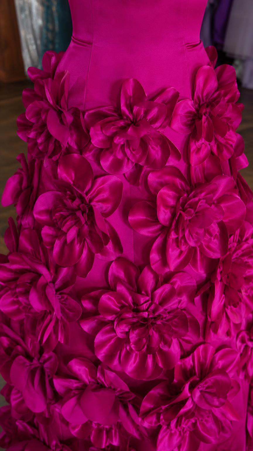 Close-up detail of 3D fabric flower appliques on the skirt