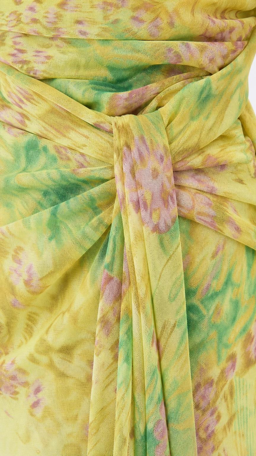 Close-up detail of draped waist knot and fabric texture