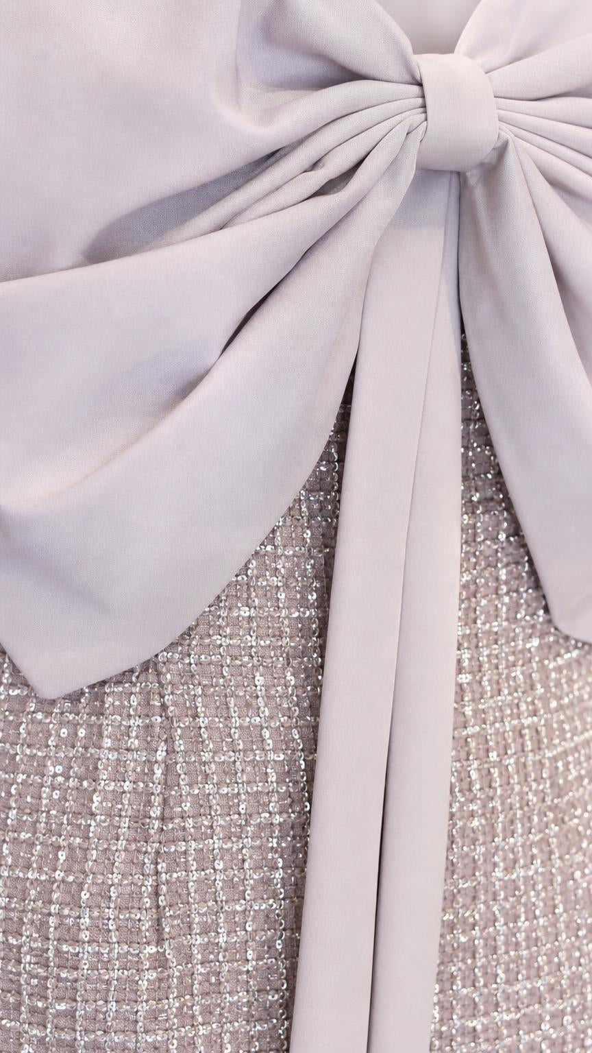 Close-up of the oversized bow and textured fabric detail