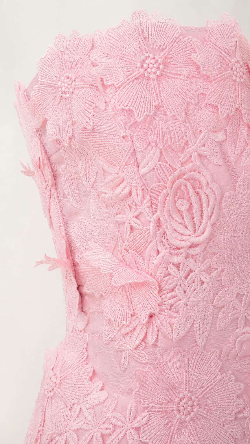 Close up of pink 3d floral applique texture on dress