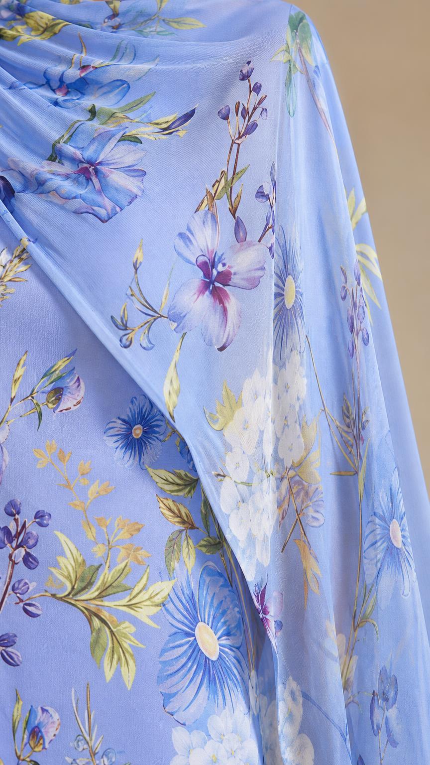 Close-up texture view of blue floral chiffon fabric
