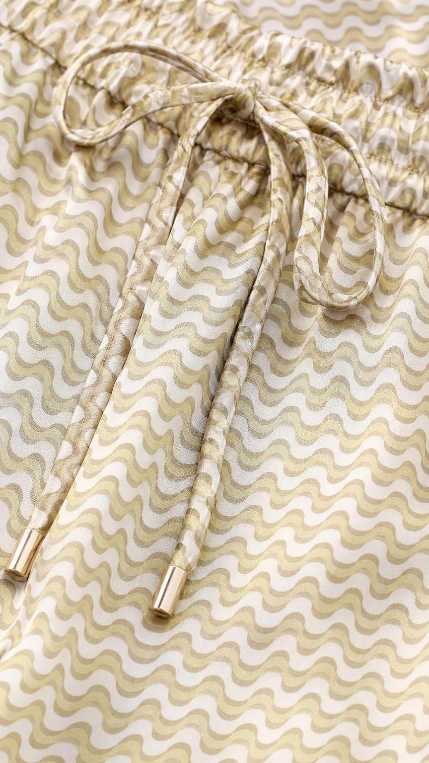 Close-up of drawstring waistband and wavy fabric texture