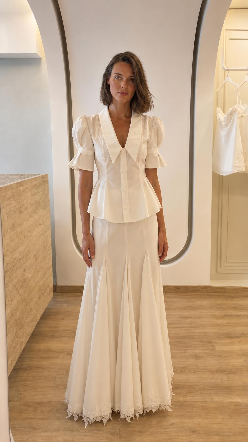 Front view of woman in white two-piece peplum top and maxi skirt set variant